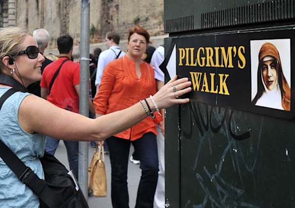 Pilgrims walk the Pilgrim Walk in the streets of Rome.