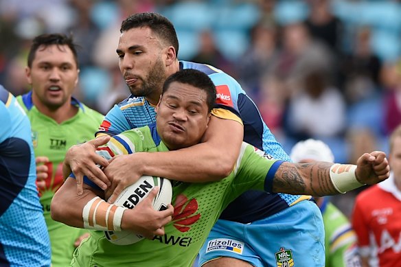Joseph Leilua of the Raiders is tackled.