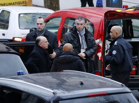Police, paramedics and firefighters at the scene of the shooting in the south Paris on Thursday, January 8. 