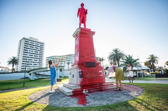 Statue of Captain James Cook at St Kilda beach covered in red paint on Australia Day. 