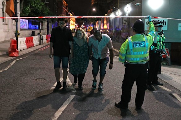  Police officers clear the area near Borough market at London Bridge.