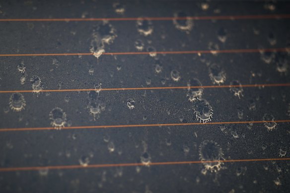 A light spitting of rain lands on a dusty car window in Tenterfield, NSW.