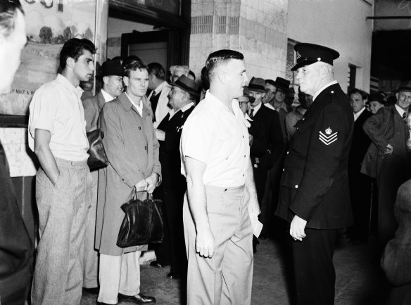 Police break up an election meeting of the Australian Communist Party at a Bondi Junction Hotel in April 1951. 