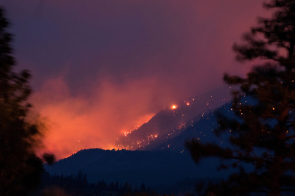 A wildfire near Lytton in Canada’s British Columbia in early July. The town recorded 49.6 degrees in late June, smashing the nation’s previous record temperature by a shocking five degrees.