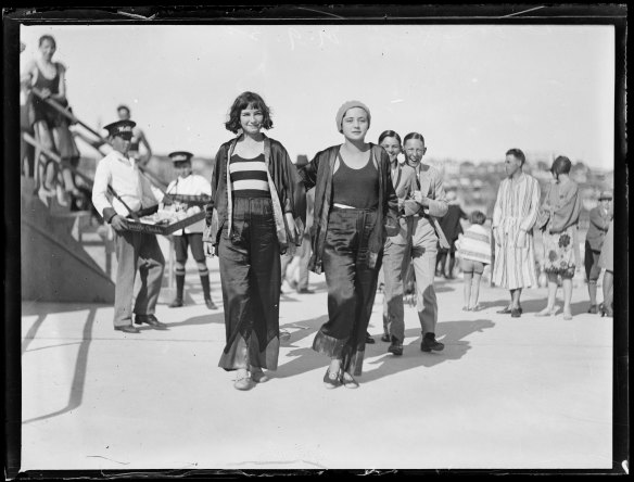 Two women promenading at Bondi Beach c.1930. Image courtesy of the National Library of Australia
