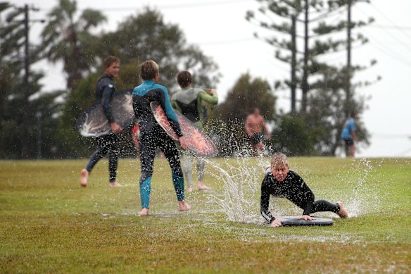 Kids making the most of the wet weather at Dawes Park Barrack Point, Wollongong.
