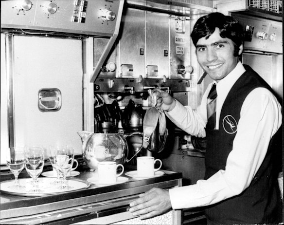 1975. Original caption: "It's a knockout job. Former Australian featherweight champion, Lucky Gattellari begins a new career as a Qantas flight steward. He is pictured in the Qantas 747 flight simulator at Sydney Airport."