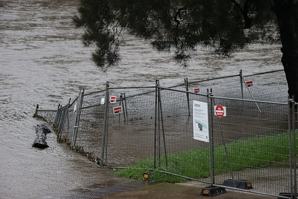 A fence that surrounds the Powerhouse Museum site may succumb to the strong current.