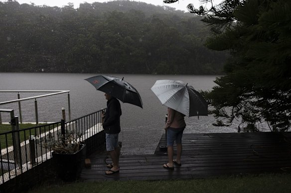 Residents Judith and Spiro on Prince Edward Park Road in Woronora, who were being ordered to evacuate as the Woronora River was expected to peak at 1.30pm.