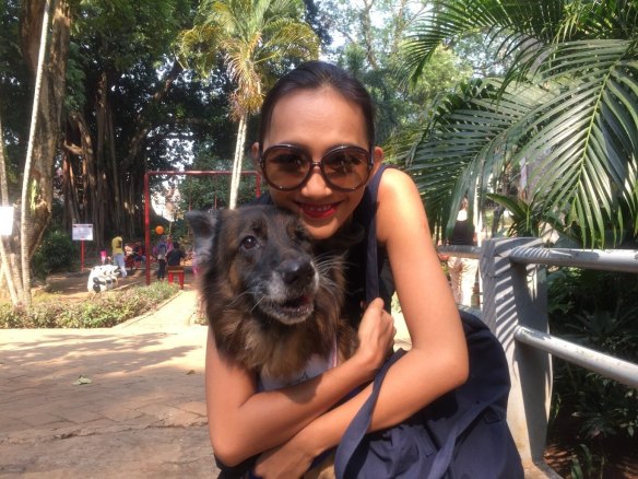 A member of the Dog Meat-Free Indonesia coalition with a rescued dog.