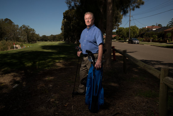 Frank Bates, the president of Beverley Park Golf Club, stands in front of trees that will be removed to build a security fence around the golf course.