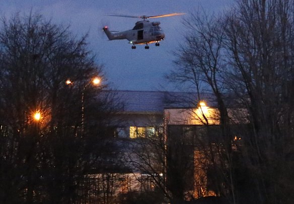 A helicopter hovers after the final assault at the scene of a hostage taking at an industrial zone in Dammartin-en-Goele, north-east of Paris.