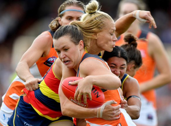 Wrapped up: Alyce Parker of the Giants is tackled by Erin Phillips.