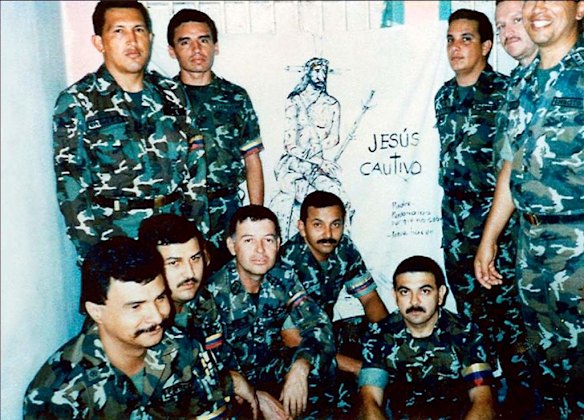 In this photo released by Miraflores Press Office, Hugo Chavez, top left, poses with fellow members of the failed coup as they serve time in Yare II jail near Caracas, Venezuela.