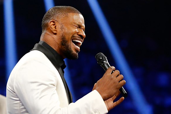 Jamie Foxx sings the national anthem of the United States of America before the welterweight unification championship bout between Floyd Mayweather Jr. and Manny Pacquiao.