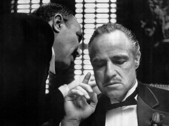  Bonasera, portrayed by Frank Puglia, asks Don Vito Corleone, portrayed by Marlon Brando, right, for a favour in a scene from the 1972 movie “The Godfather”. 