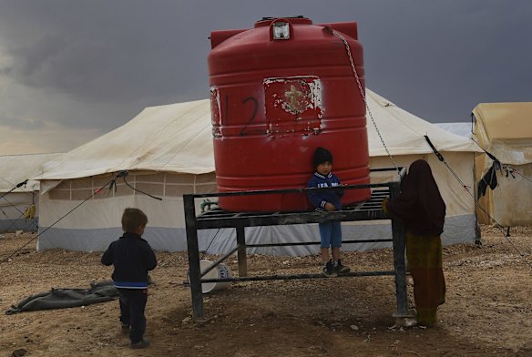 Children play amongst the rocks in the foreign annex of Al-Hawl camp in North East Syria. 