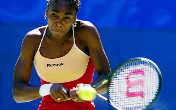 Venus Williams plays a backhand during her match against Elena Dementieva in the women's gold medal tennis match.