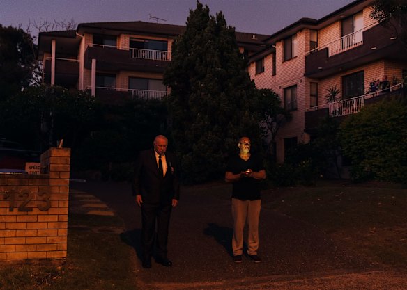 Two ex servicemen, one a former sailor, the other a Vietnam veteran, stand outside their homes in Dee Why at 6am to observe a minute silence on Anzac Day.