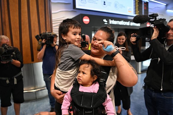 Lisa Te Tai and her granddaughter Manaia Taalili arrive in Auckland to be greeted by her son Marcelle Te Tai and his son.
