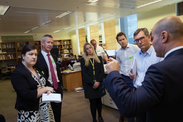 Treasurer Josh Frydenberg goes through the budget with editors and journalists of The Sydney Morning Herald and The Age during the budget lock up at Parliament House in Canberra.