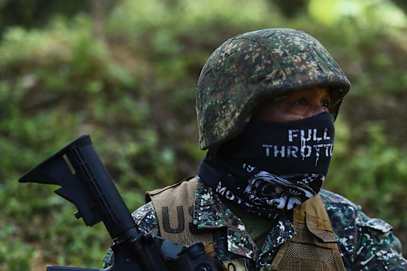 A Filipino marine pauses during firing during urban combat shooting at the firing range near the Philippine's 3rd Marine Brigade base on Palawan, Philippines. 