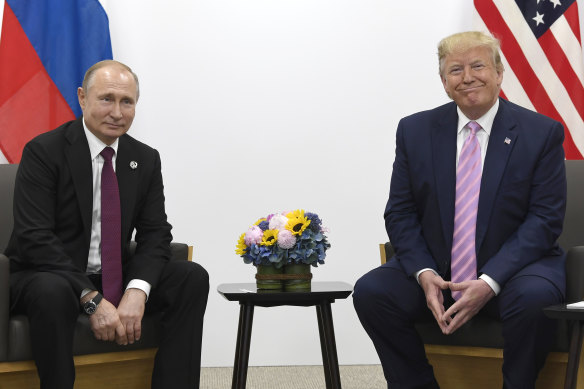 US President Donald Trump, right, meets with Russian President Vladimir Putin during a bilateral meeting on the sidelines of the G-20 summit in Osaka.