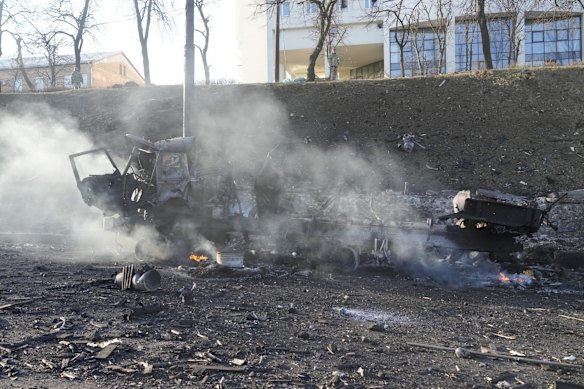 The burning wreckage of a military truck on a Kyiv street. Residents were urged to seek shelter as Russians advanced.