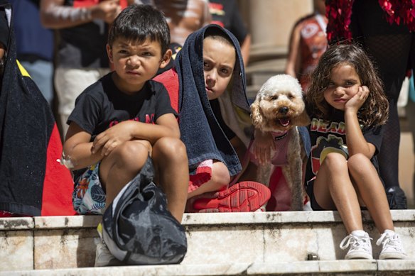Children listen to the speeches at the Invasion Day March in Sydney 
