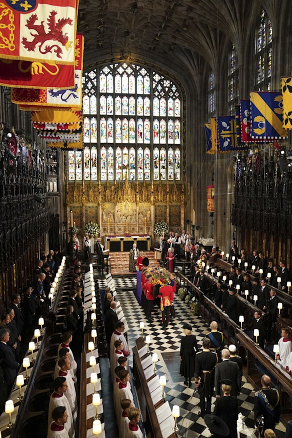 Pallbearers place the coffin of Britain's Queen Elizabeth II as it arrives for a committal service at St George's Chapel, Windsor Castle, in Windsor.