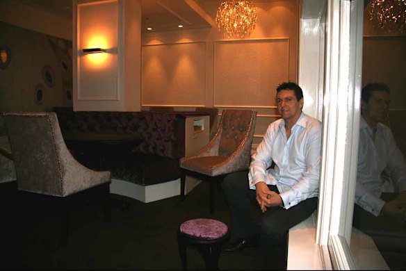 Justin North inside the Becasse dining room. The pink stool is intended as a handbag rest.