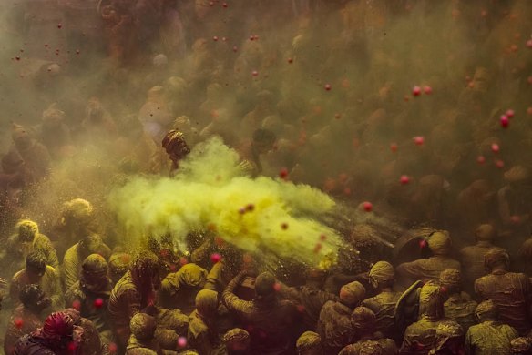 Hindu devotees play with colour during Lathmaar Holi celebrations in the village of Barsana, India.