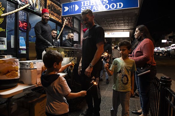 A family enjoys Ramadan Nights along Haldon Street, Lakemba.