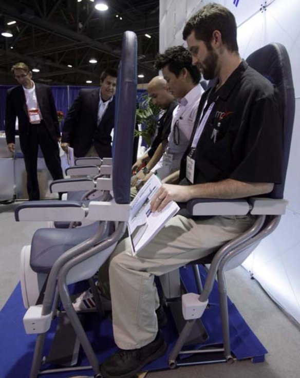 John Jackson tries out Italian company Aviointeriors' new aircraft 'standing seat' at the Aircraft Interiors Expo in Long Beach, California.
