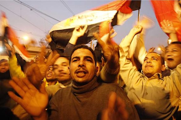 Egyptian anti-government protesters celebrate outside the presidential palace in Cairo.