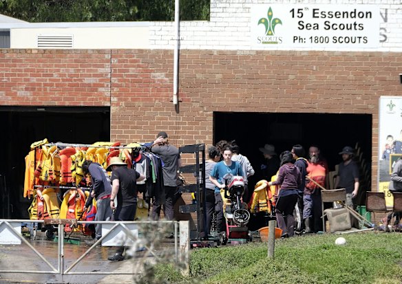Clean-up teams near the Maribyrnong River on Sunday.