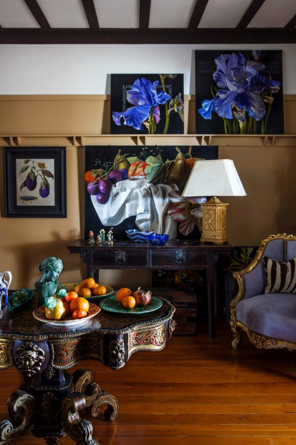“The table we brought back from Naples,” says Diana. The fruit, displayed as if in a Renaissance painting, is an everyday tableau for Diana. An array of her artwork adorns the apartment’s walls."