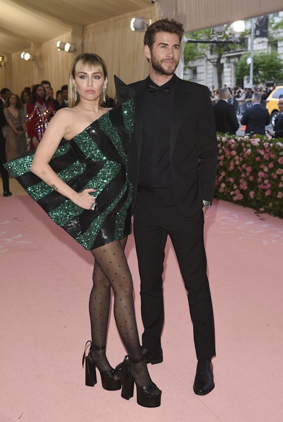 Miley Cyrus, left, and Liam Hemsworth attend The Metropolitan Museum of Art's Costume Institute benefit gala celebrating the opening of the "Camp: Notes on Fashion" exhibition.