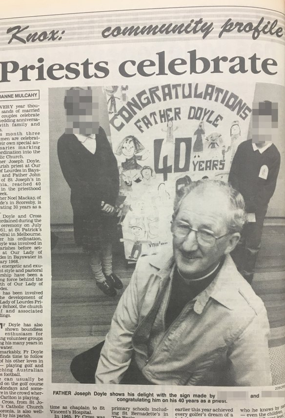 Father Joseph Doyle, pictured with children in 1991, on his 40-year anniversary as a priest.