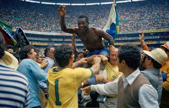 Brazil's Pele, centre is hoisted on the shoulders of his teammates after Brazil won the 1970 World Cup soccer final against Italy, 4-1, in Mexico City's Estadio Azteca, Mexico.