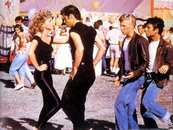 John Travolta dances with Olivia Newton-John at the conclusion of 1978 film Grease.
