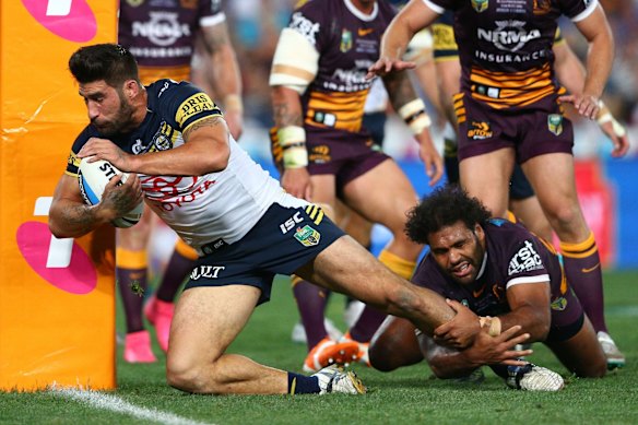 James Tamou of the Cowboys scores a try.