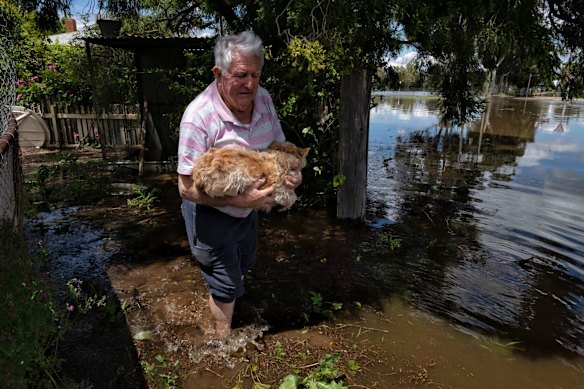 Peter Walker abandons his house in Renfree Street with his dog, Friday November 4, 2022.