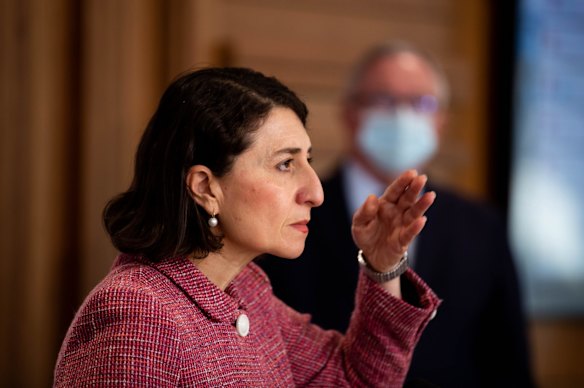 NSW Premier Gladys Berejiklian, and Health Minister, Brad Hazzard, at a daily COVID-19 update press conference on a day Sydney recorded the highest number of new positive cases during the extended lockdown. Army troops will door-knock homes of people who have tested positive to COVID-19 and those deemed to be close contacts to ensure they are isolating in a crackdown on Sydney hotspots after NSW reached a record number of new infections.