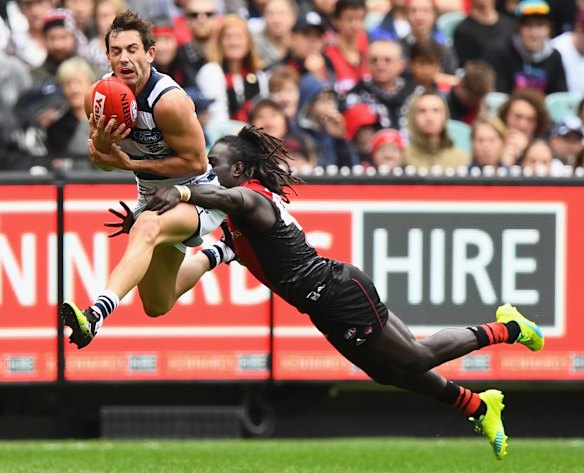 Catd' Daniel Menzel marks in front of McDonald-Tipungwuti.