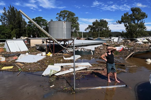Brad McCutcheon, a resident of St George Caravan Park, surveys the scene during flooding of the Hawkesbury River near Sydney in March 2021.