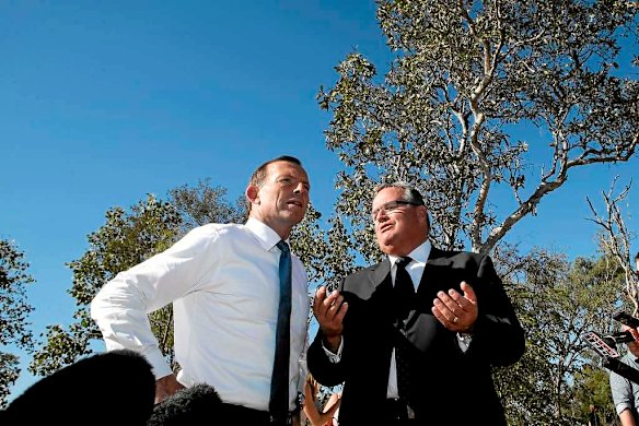 Opposition Leader Tony Abbott meets with Liberal MP Ewen Jones during a roads announcement in Townsville.