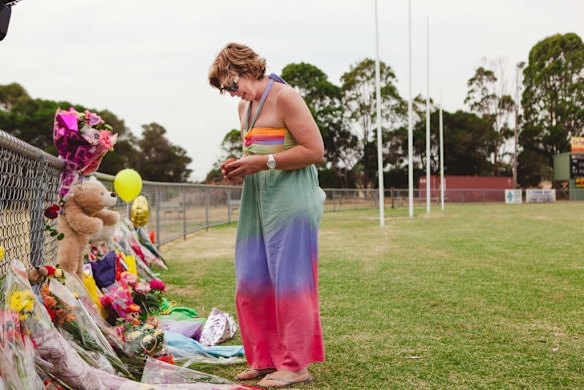 Luke Batty's mother, Rosie Batty back at Tyabb oval today reading cards well wishers have left following the murder of her son here 2 days ago.