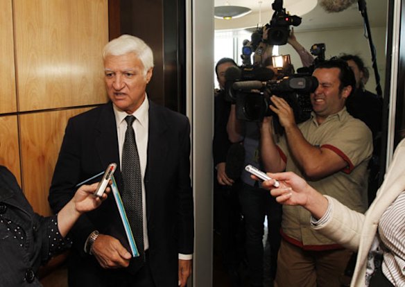 Independent Member for Kennedy Bob Katter gets questioned by representatives of the media after meeting with fellow Independents Tony Windsor and Robert Oakeshott at Parliament House in Canberra today.