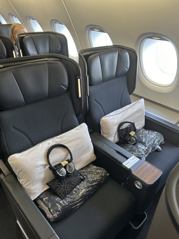 Premium economy seats come with headphones, basic amenity kit, pillow and blanket